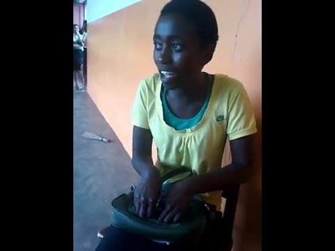 A student from Burundi starts singing a famous song. Her voice is worthy of an international star