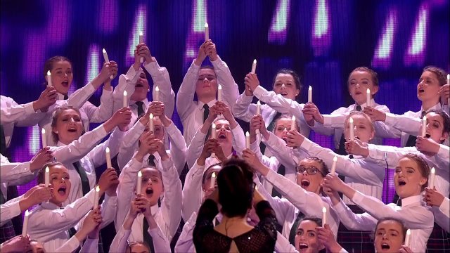 Sixty girls occupy their spot on the scene of Britain’s Got Talent. Their performance is astonishing