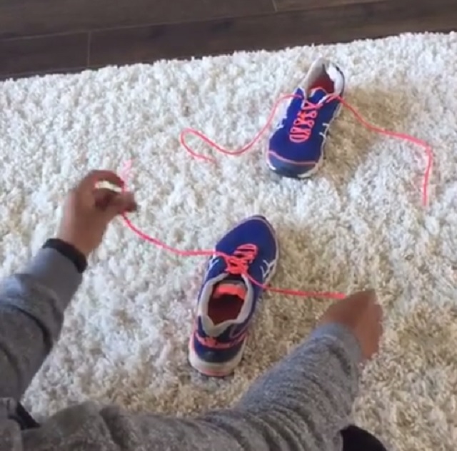 This little boy learns very quickly how to tie his shoelaces using this simple trick